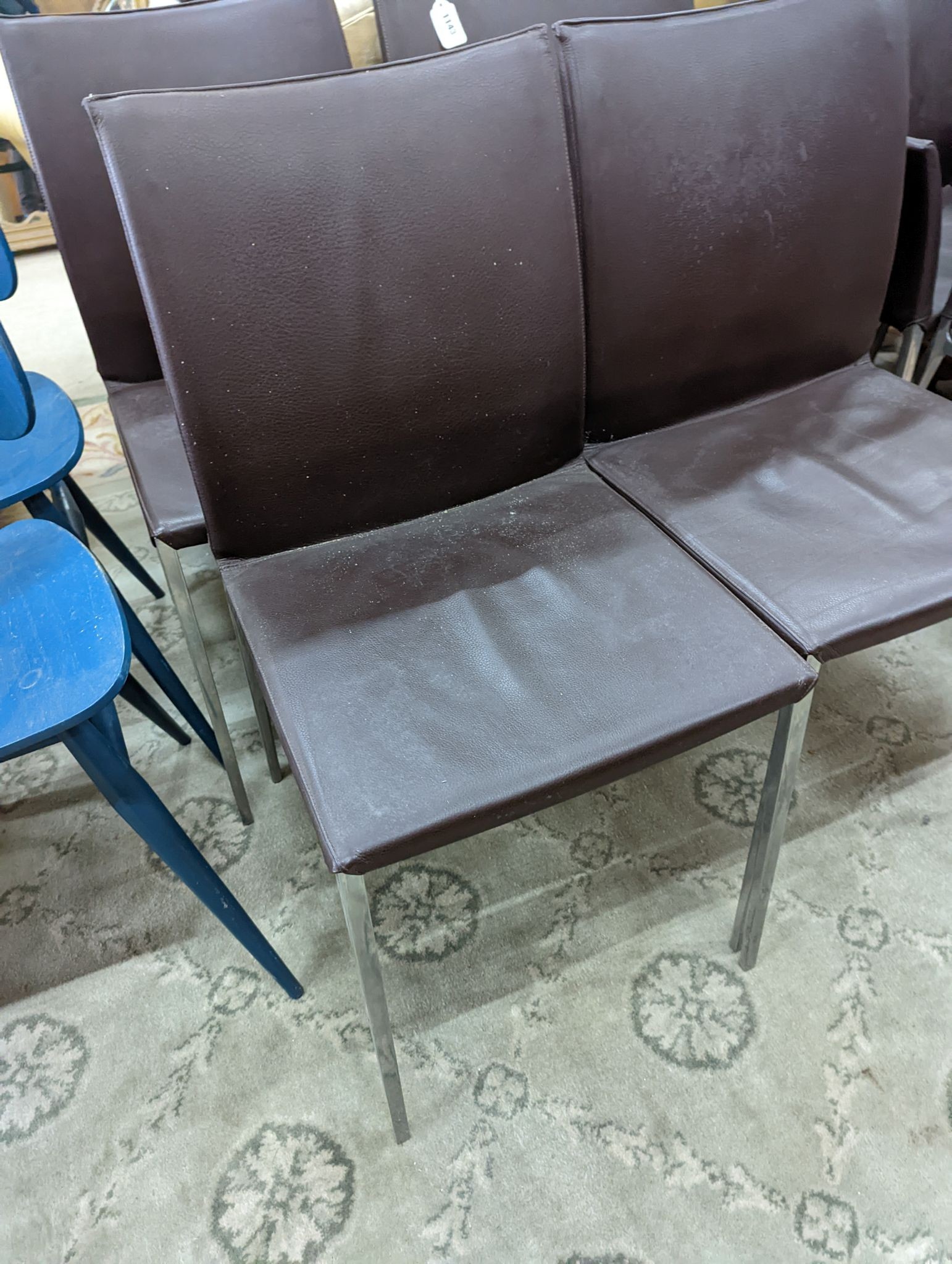 A set of six contemporary brown leather dining chairs